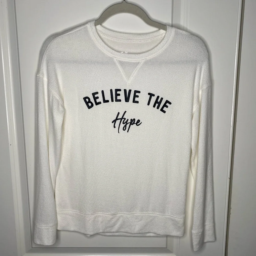 Justice “believe the hype” white fuzzy sweater